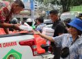 Jumat Berkah, PT Macan Sejahtera Cahaya Bagikan 300 Nasi Kotak kepada Pengendara dan Warga Medan